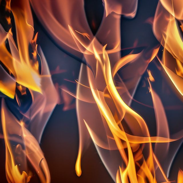 Searing Orange Flames with Blue tinge on Black Background Image Download